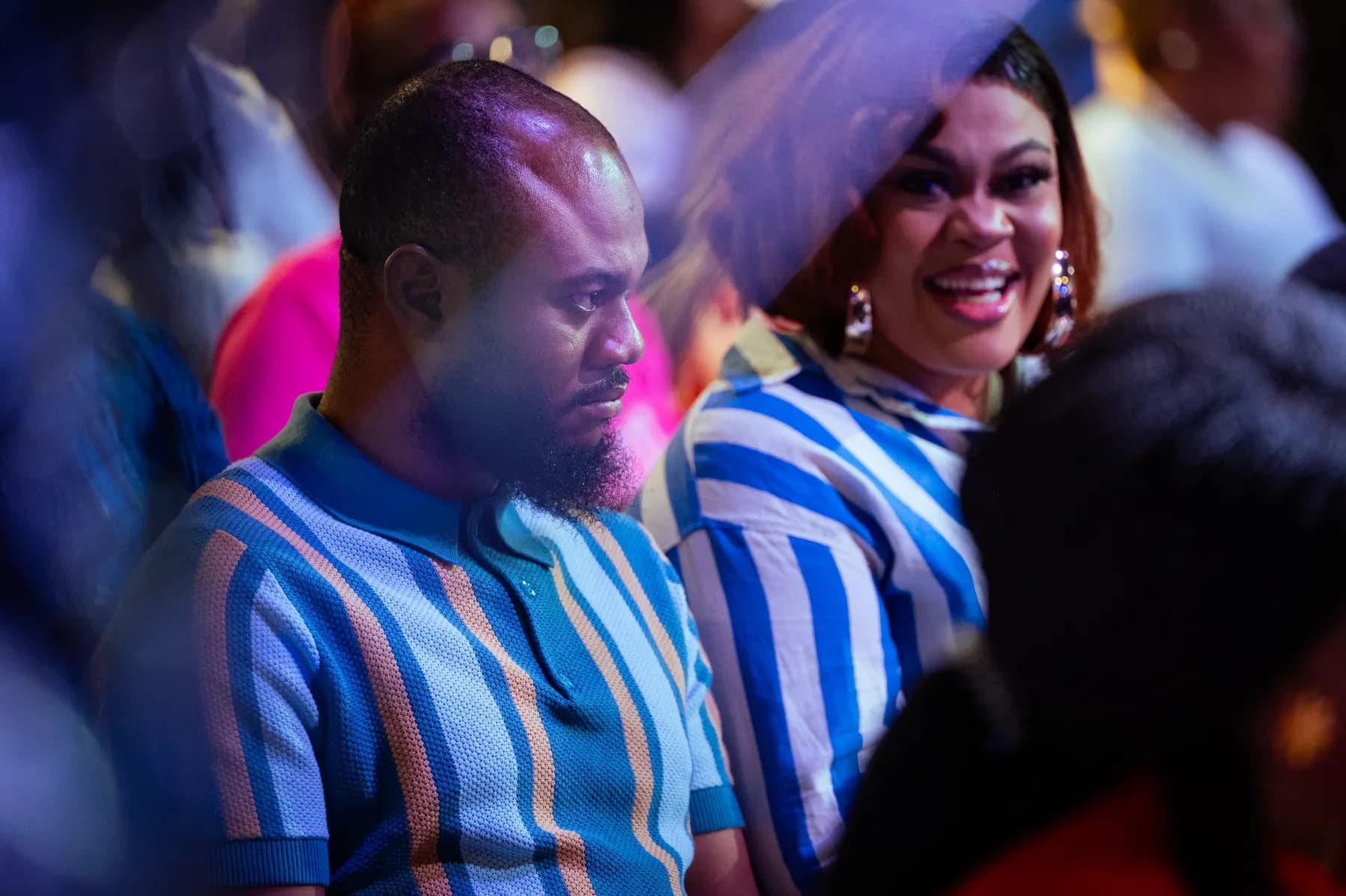 Members sharing a joyful moment in the congregation