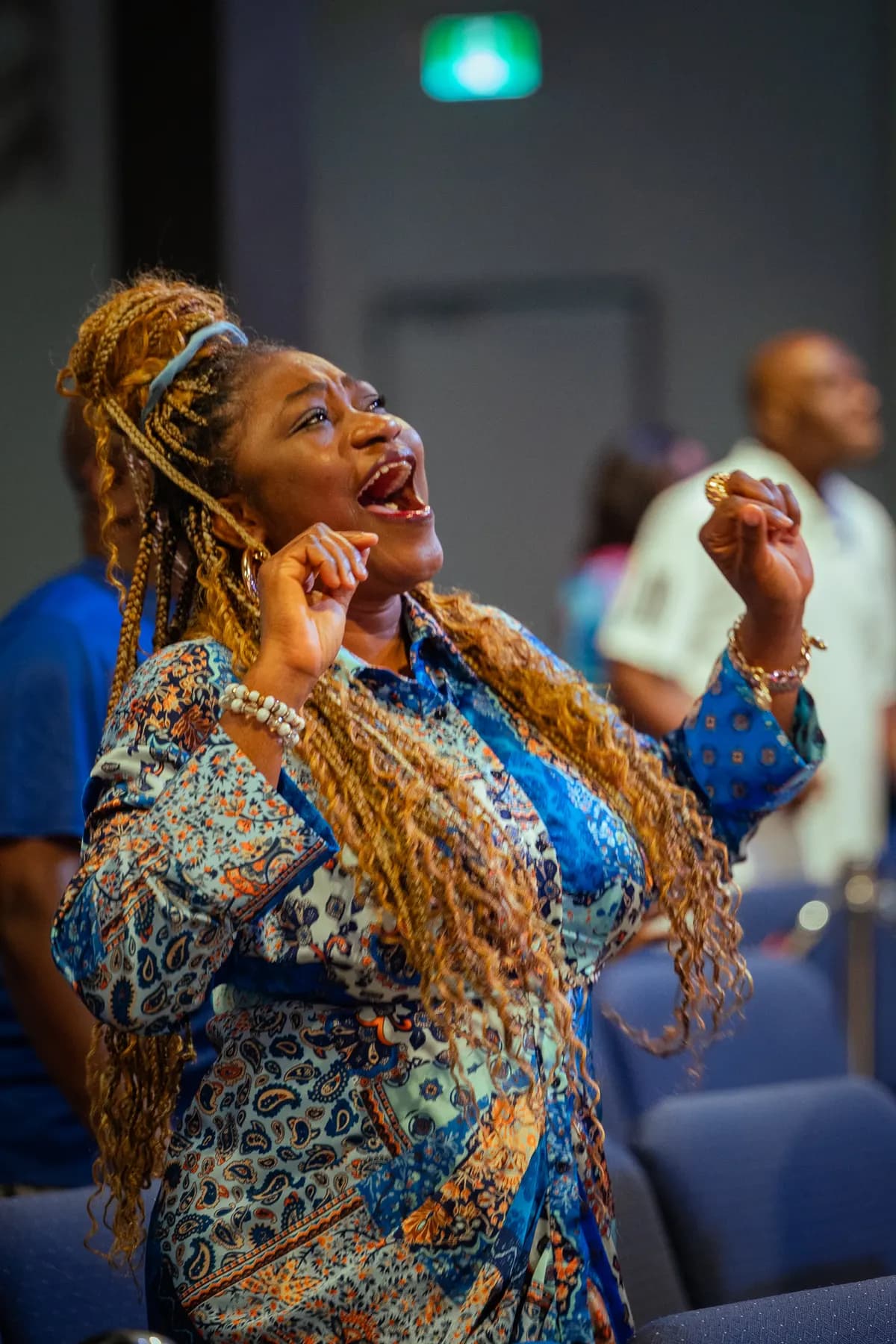 A church member celebrating during worship