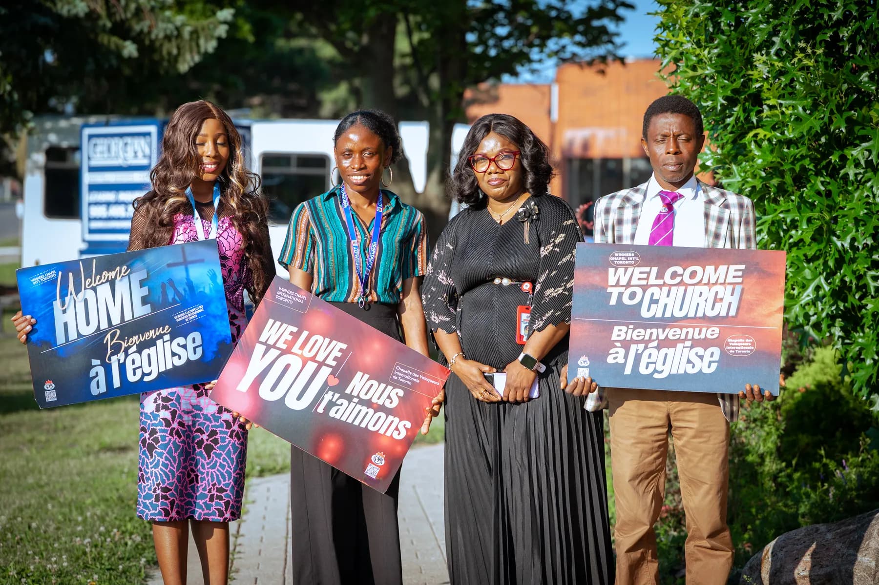 The welcome team greeting guests outside the church